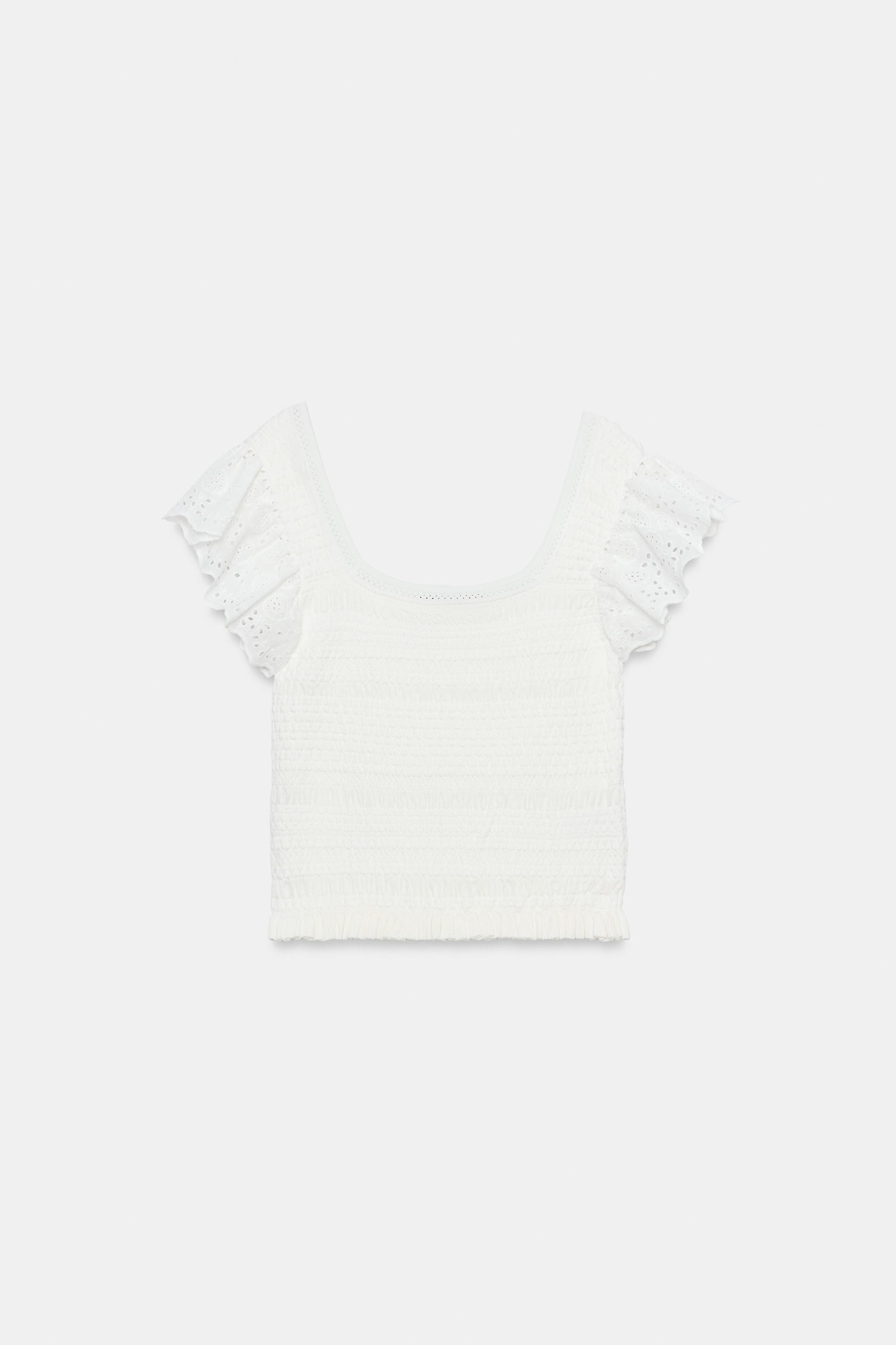 TOP EN MAILLE À BRODERIES PERFORÉES
